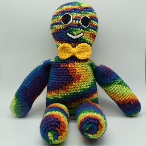 Hand crafted Crochet Rainbow Doll Plush With Yellow Bow Tie and Embroidered face